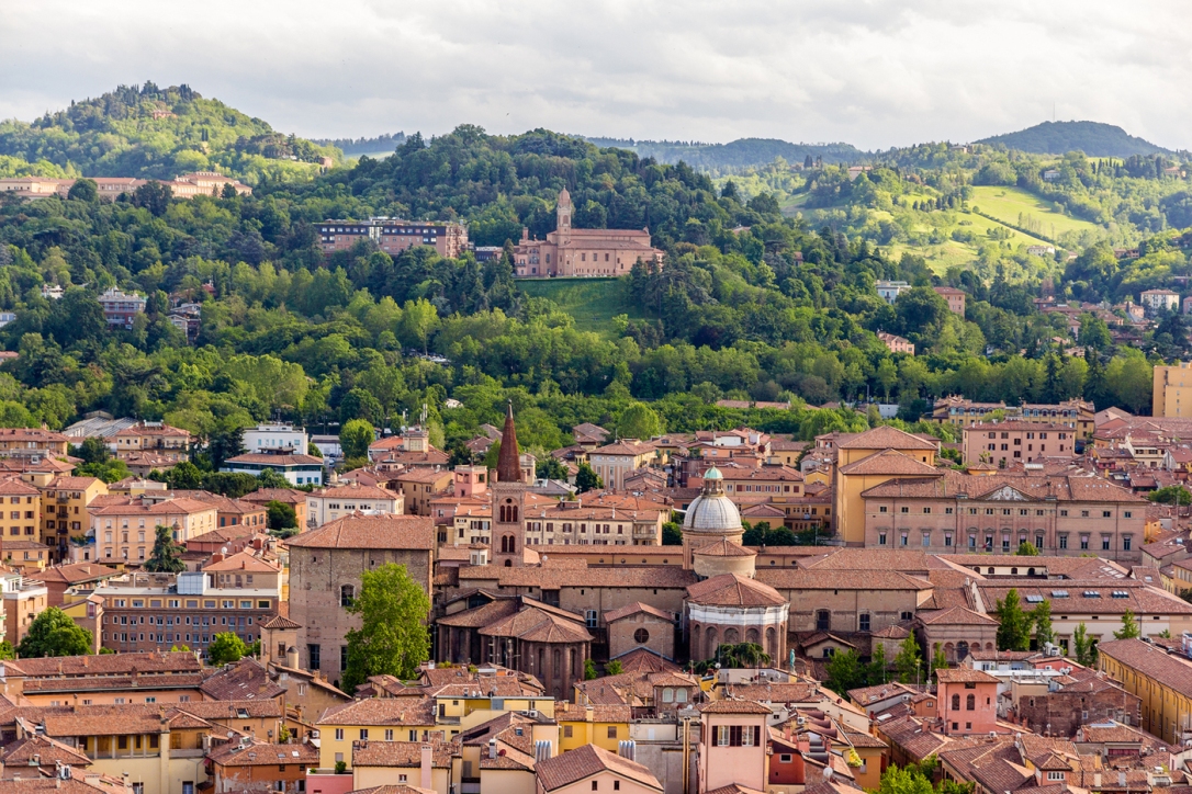 View of Bologna's hills and red roofs from city center